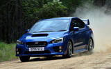 Subaru WRX STi on dirt front quarter tracking