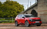 Red Kia Sportage under a bridge Red Kia Sportage under a bridge