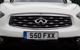 The double-arch grille and wave-form bonnet with its pronounced bulge at each side are distinctive Infiniti FX front grille