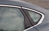 The narrowing window line that rises over the rear wheel arch gives a coupe appearance Infiniti M rear window