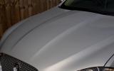 Bonnet curves down towards the grille, rather than ending in horizontal line; bulge is pronounced Jaguar XF bonnet curves