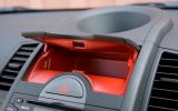 Red lining for glovebox and centre console box is quite a surprise when you open the lids. Rubber anti-slip mats would be useful Kia Soul red-lined glovebox