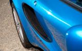 Lateral air intakes have a simple mesh; it's discretely effective Lotus Elise side air vents