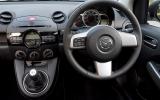 The gearstick is mounted high, and is well positioned to operate Mazda 2