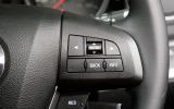 The steering wheel features a leather rim  as well as controls for the stereo, cruise control, trip computer and phone Mazda 3 steering wheel buttons