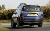 Outlander has plenty of body roll when cornering, but it  does it progressively Mitsubishi Outlander rear cornering