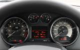 Chrome-rimmed dials look suitably high class Peugeot RCZ instrument cluster