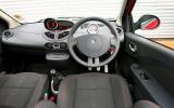 The interior features dull, dark architecture with parts-bin switchgear Renault Twingo RS133 dashboard