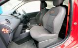 Front cabin features chunky sports seats and vivid orange seatbelts Renault Twingo RS 133 front seats