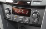 The dashboard is moulded from unappealing, hard grey plastic Suzuki Swift climate control switchgear