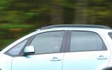 Waistline is distinctive with its Coke-bottle front wing line Suzuki SX4 side profile