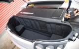 With no storage space up front, you’ll have to stick your weekend luggage here Tesla Roadster boot space