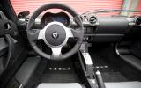The Tesla shares the dashboard, steering wheel, windscreen and canvas roof with the Elise Tesla Roadster dashboard