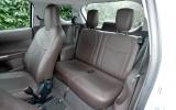 An adult can fit behind the front passenger, but it’s kids only behind the driver Toyota iQ rear seats