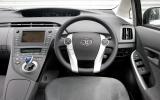 Circular switch pads are replicated as images on the instrument screen when touched Toyota Prius dashboard