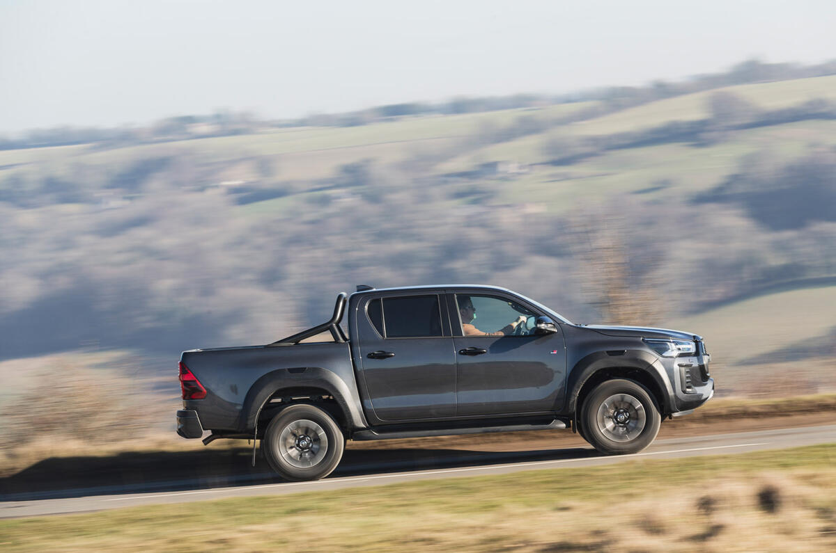 03 Toyota Hilux GR Sport RT 2023 side driving 03 Toyota Hilux GR Sport RT 2023 side driving