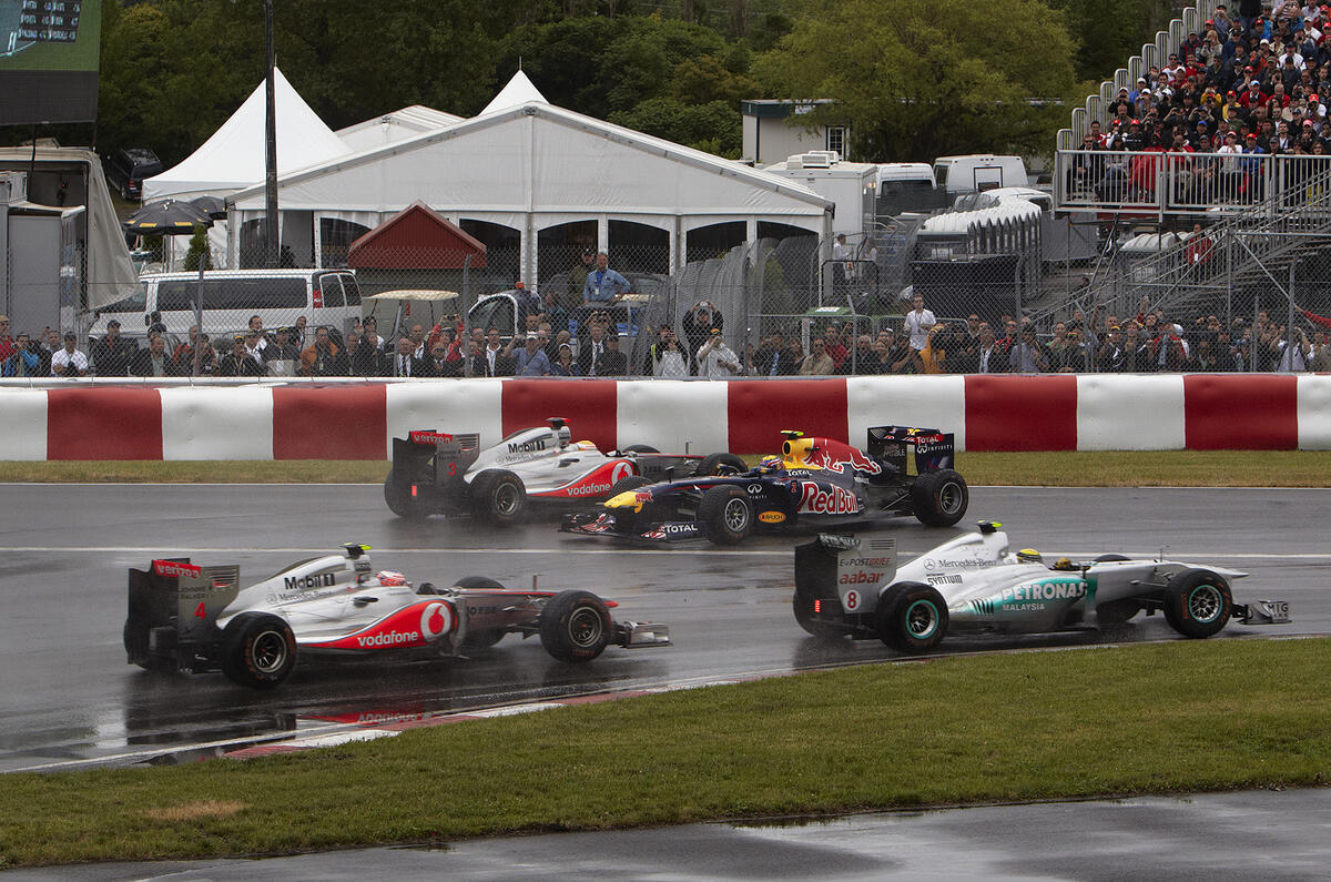 Button triumphs in Canada classic