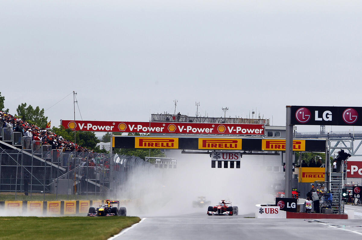 Button triumphs in Canada classic