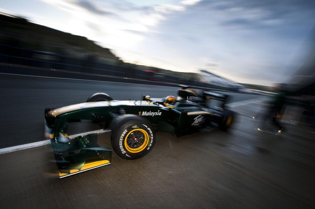 Lotus F1 returns; Vettel fastest