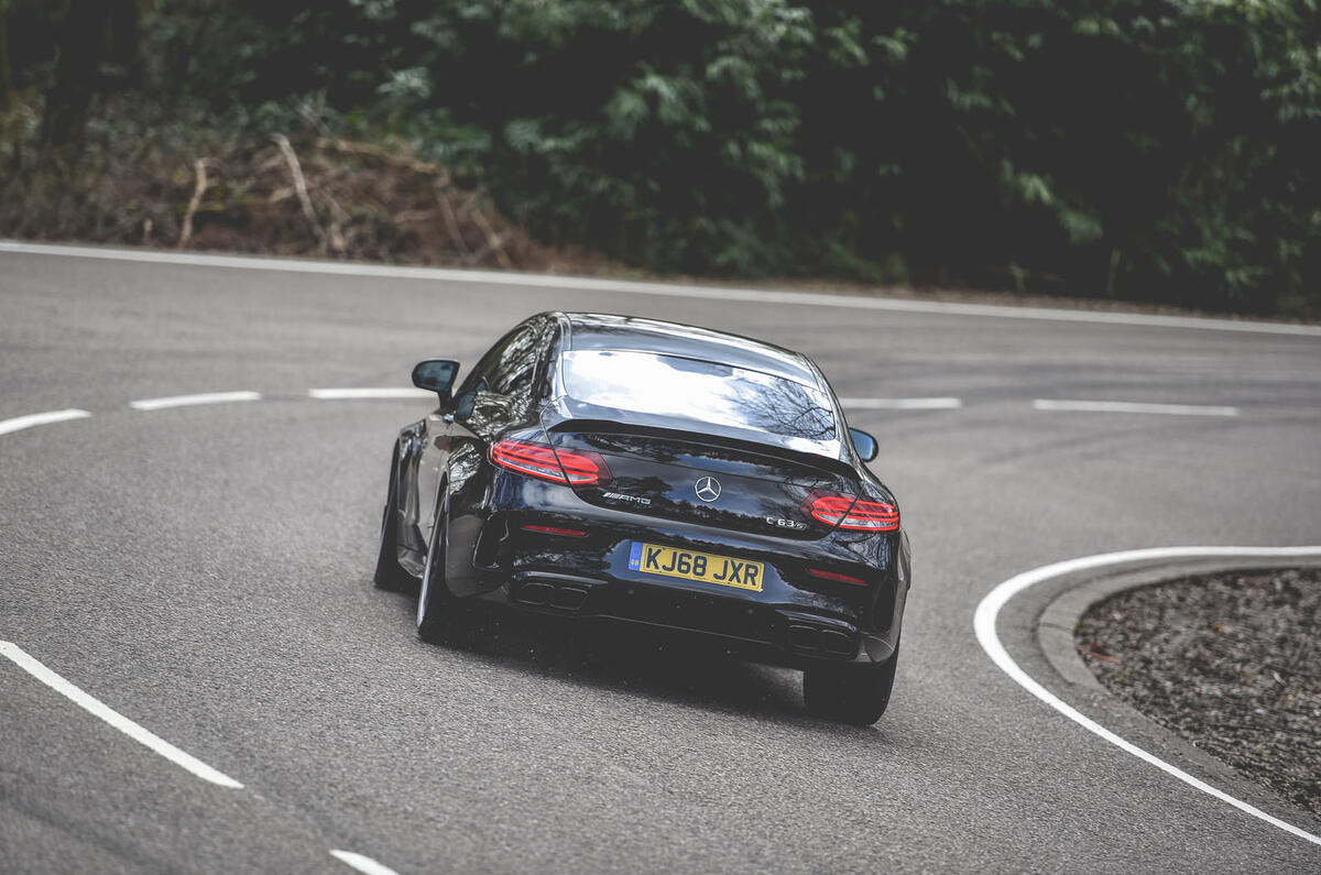 Mercedes-AMG C63 Coupé 2019 road test review - cornering rear