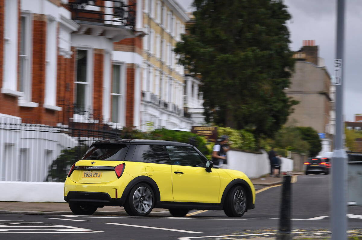 2024 Mini Cooper C 3dr in yellow   cornering in town, rear