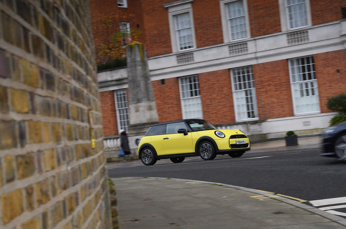 2024 Mini Cooper C 3dr in yellow   driving through town, front side