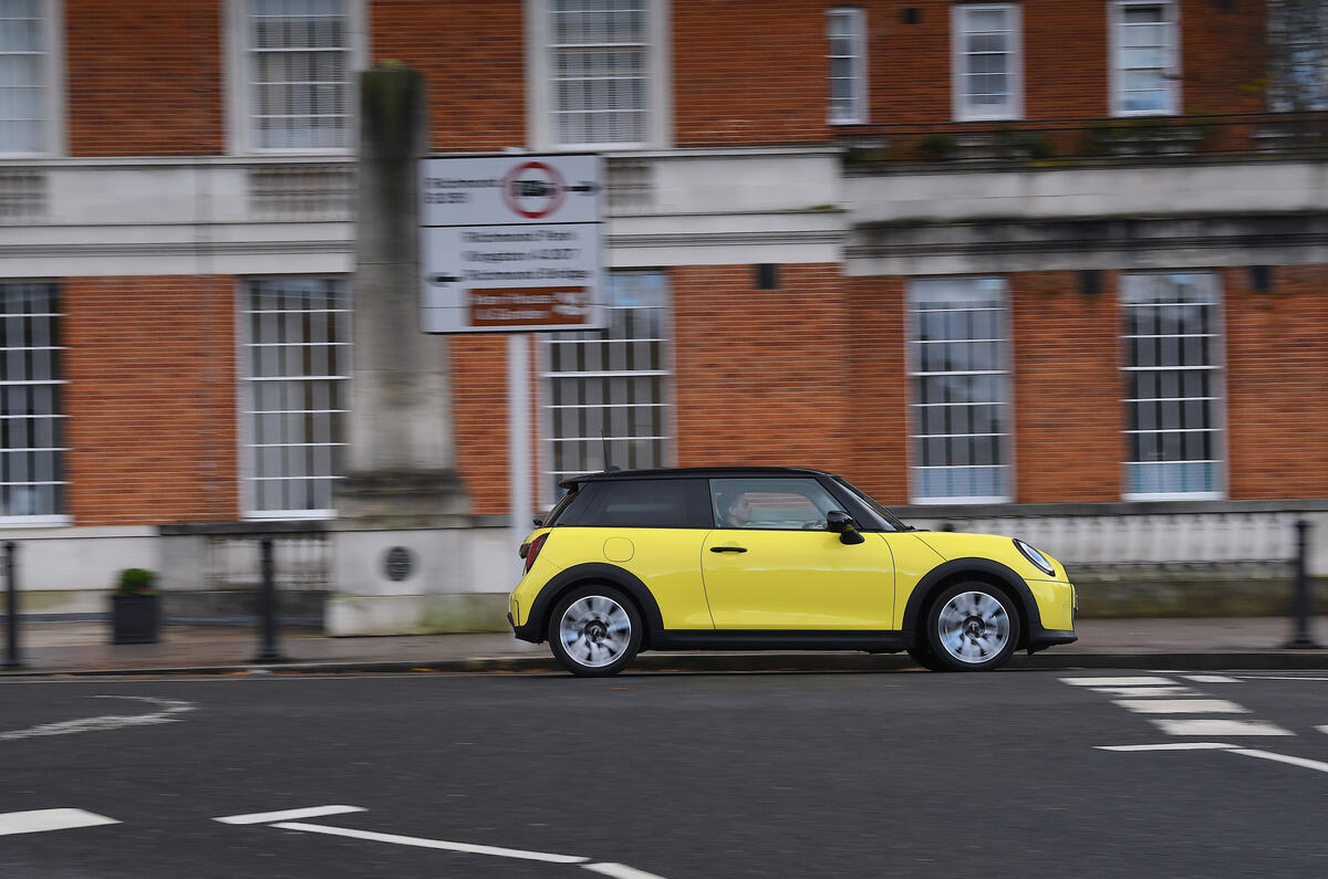 2024 Mini Cooper C 3dr in yellow   driving through town, side