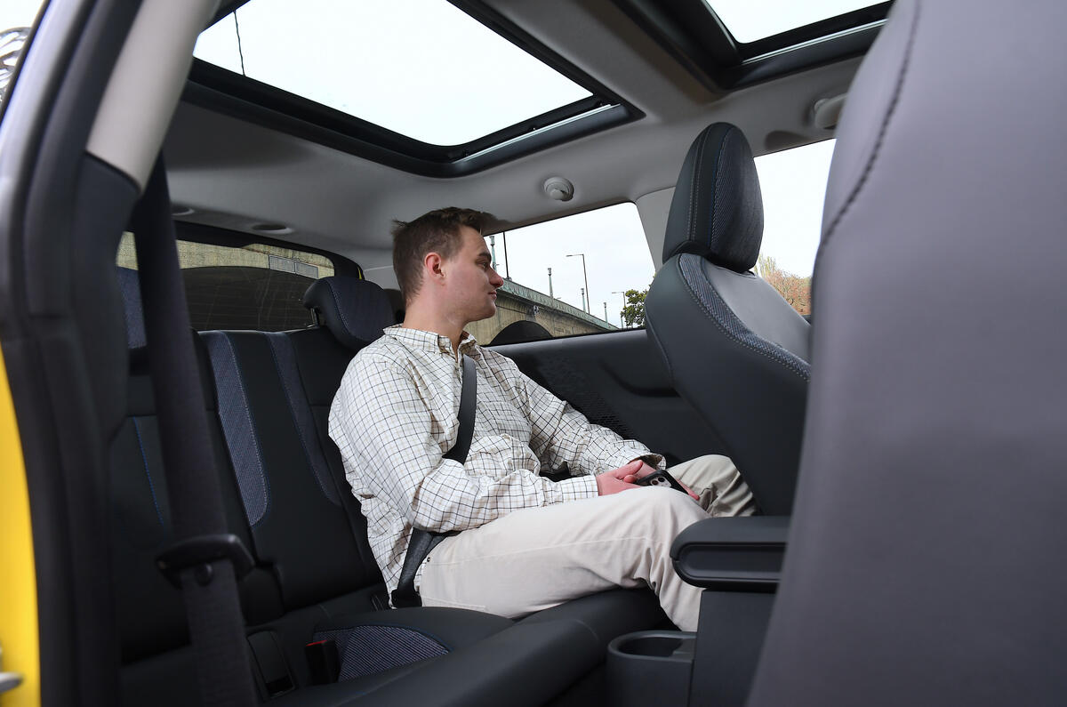 2024 Mini Cooper C 3dr in yellow   sitting in rear seats