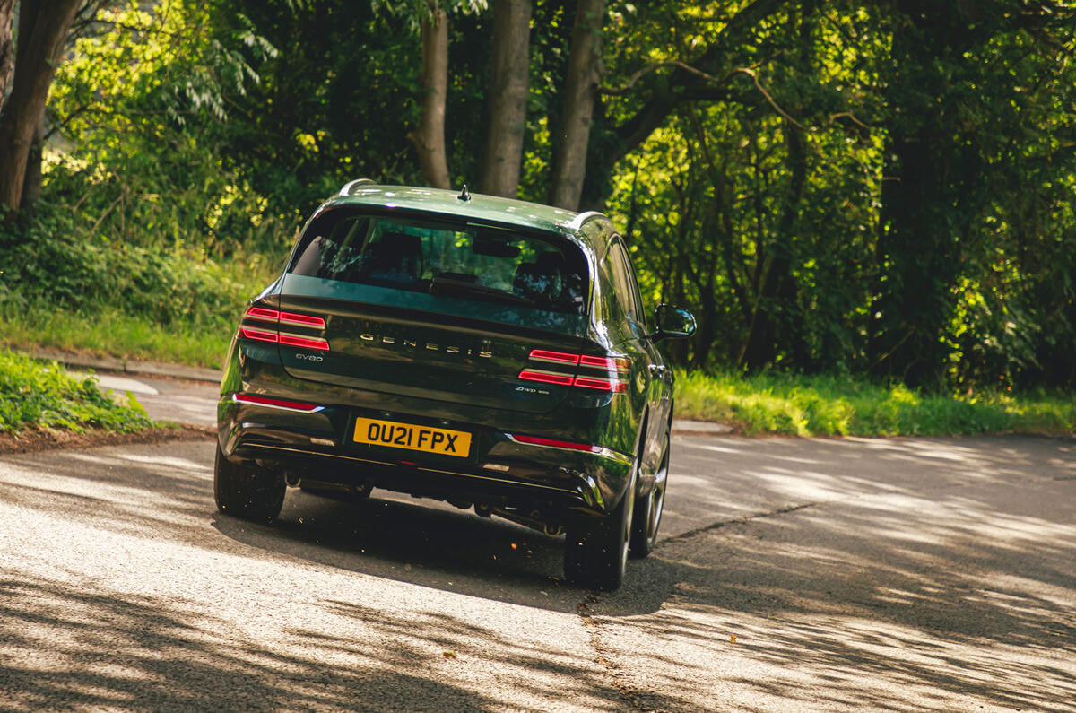 28 Genesis GV80 2021 road test review cornering rear 28 Genesis GV80 2021 road test review cornering rear