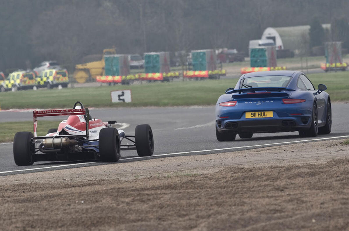 no title Porsche's 911 Turbo S takes on an F4 racer