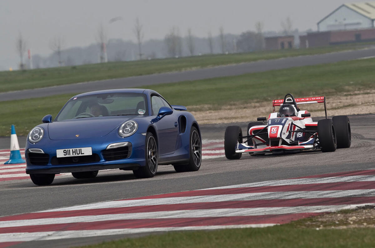 no title Porsche's 911 Turbo S takes on an F4 racer