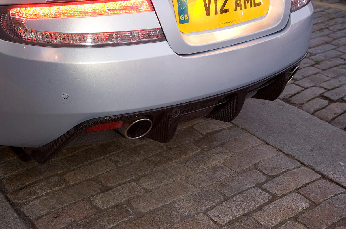 Rear diffuser is made from carbonfibre. The aero work continues out of sight under the car Aston Martin DBS rear diffuser
