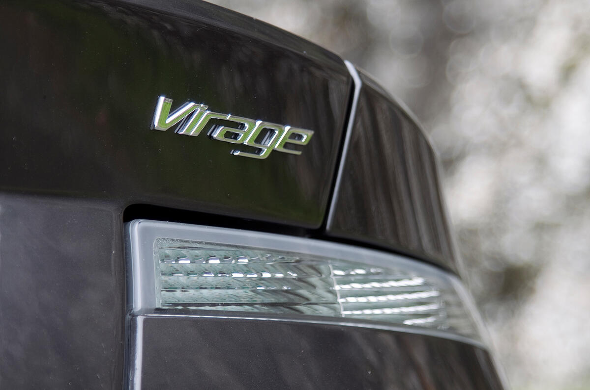 Virage is intentionally more understated than the DBS, so the rear lip is less overt and there is none of the chrome highlights. We think it looks all the prettier for it Aston Martin Virage badging