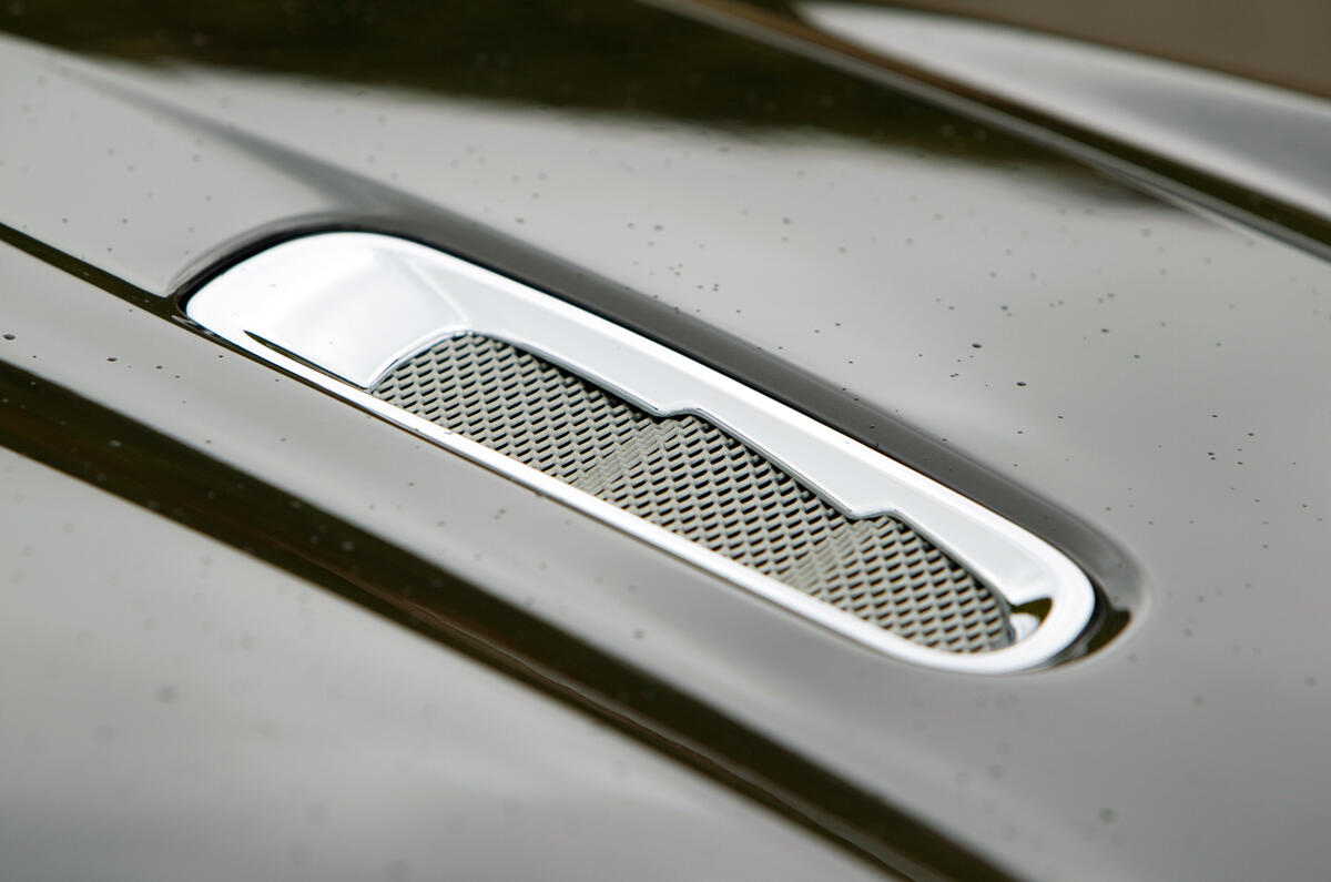 Deeply sculpted side skirts emphasise the width of the Virage, which is actually 25mm broader and has wider tracks, but is 7mm shorter than the DB9 Aston Martin Virage bonnet vents