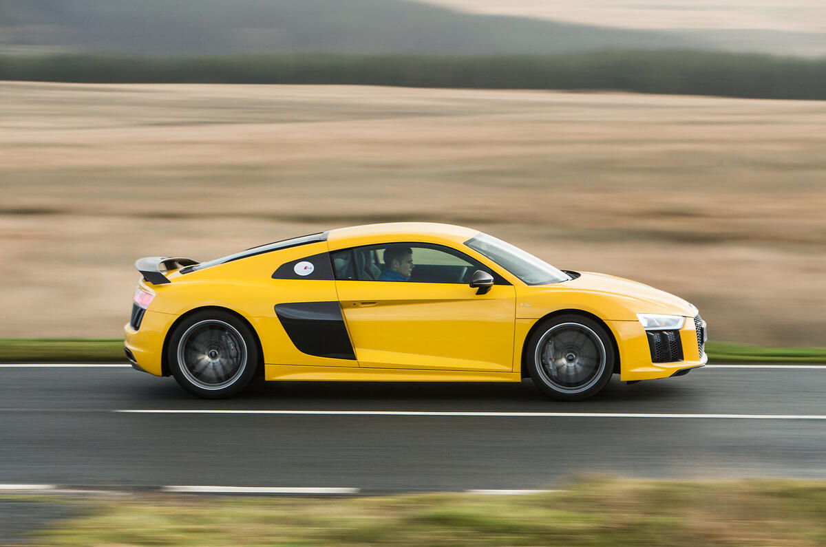 The Audi R8's needle rushes promptly to the 8700rpm redine