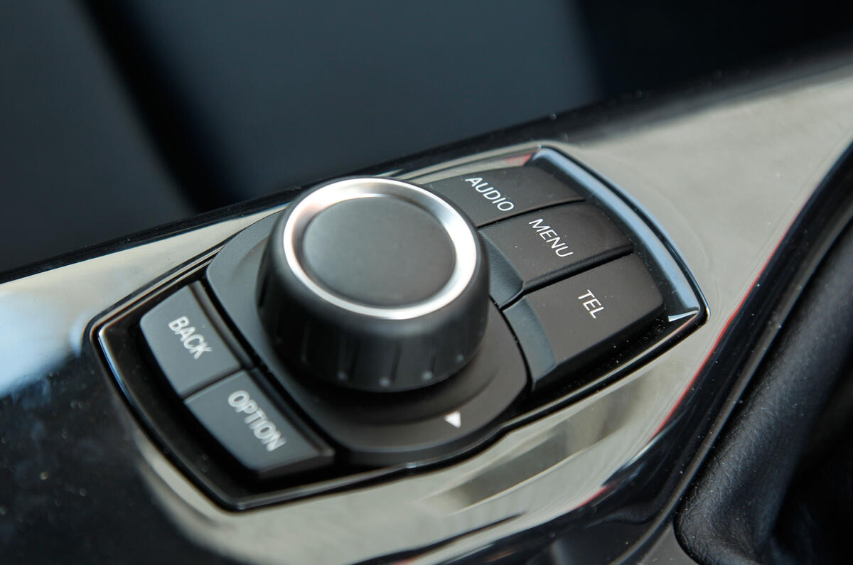 BMW's ConnectedDrive multimedia options allow you to update Facebook and Twitter accounts BMW iDrive infotainment controls
