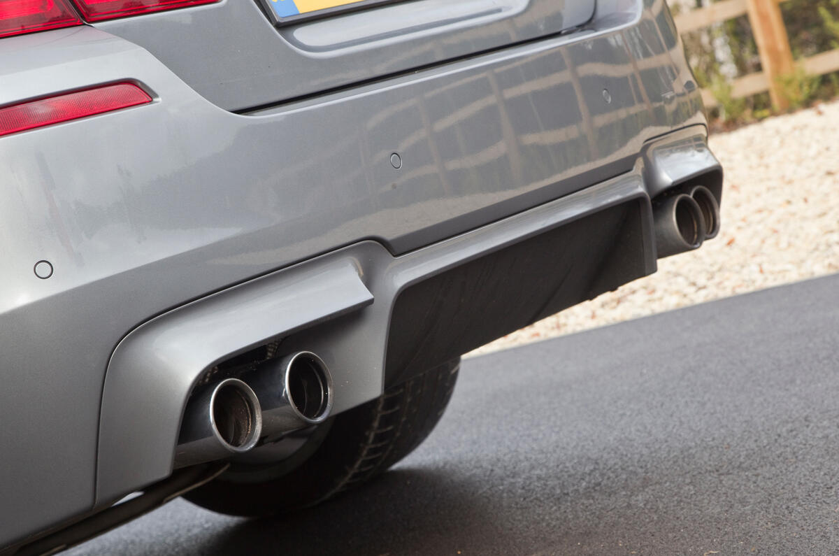 Valance diffuser panel smoothes underbody airflow BMW M5's quad exhaust system