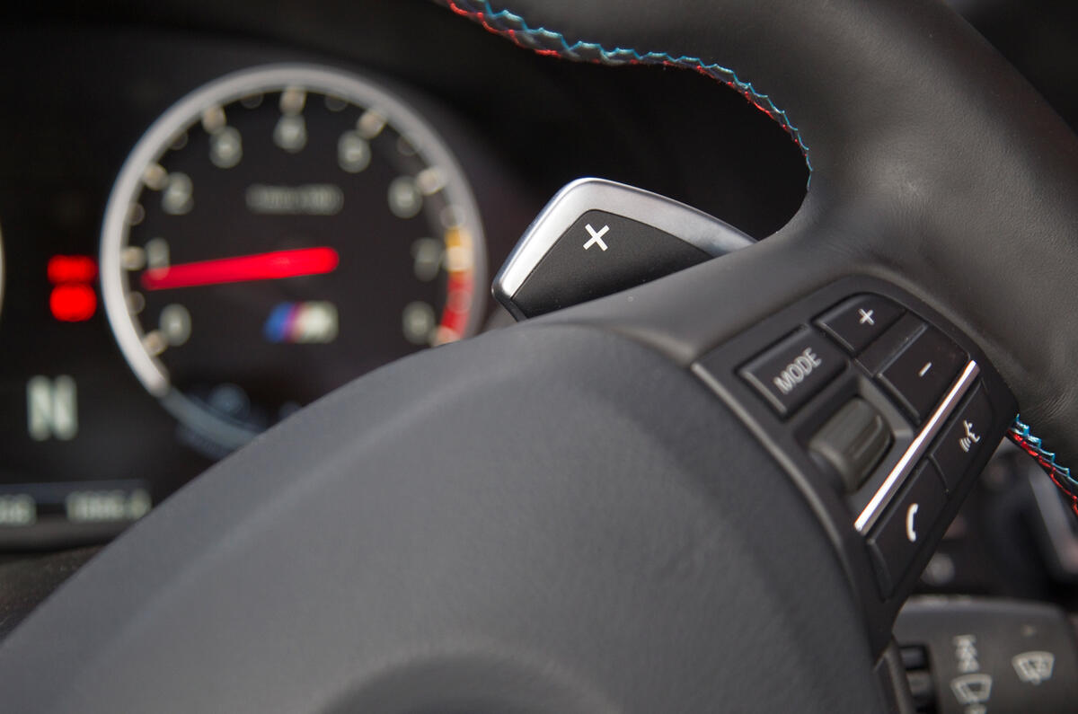 Steering wheel has two M Drive preset buttons BMW M5 flappy paddles