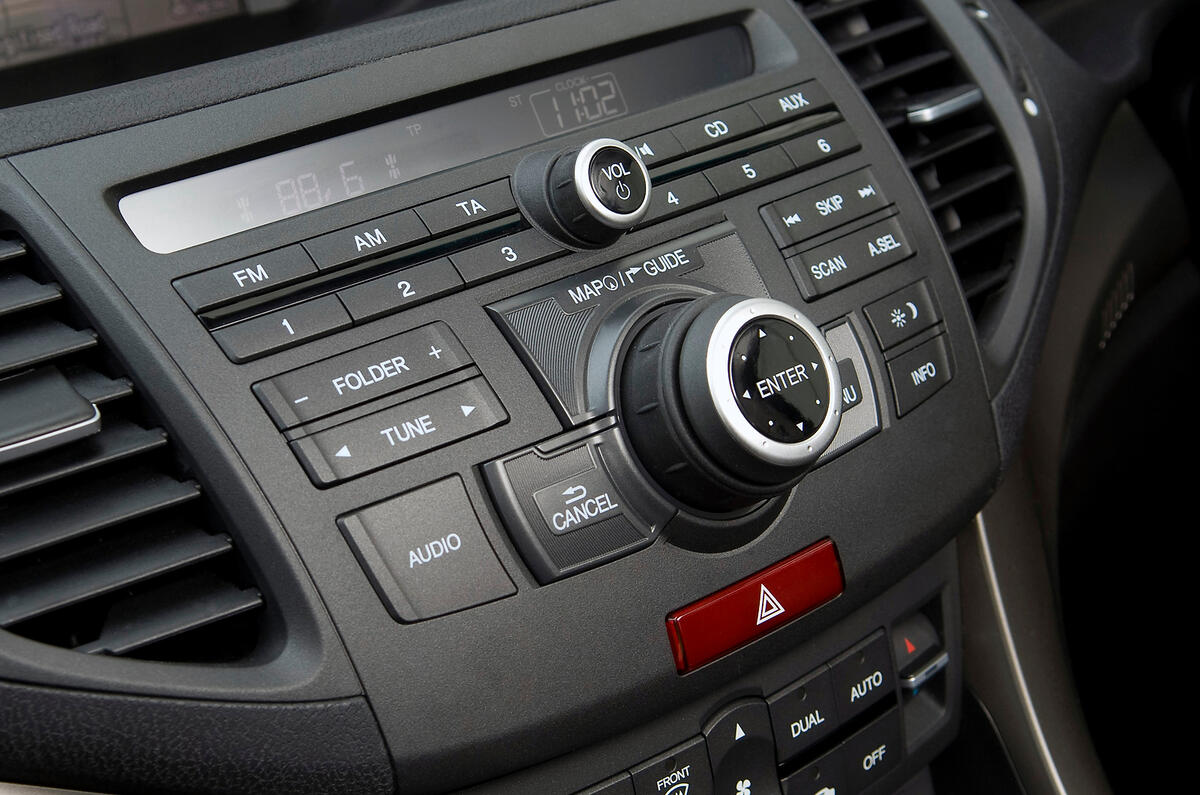Centre console is a bewildering stack of switches, knobs and controls. Takes an age to figure out Honda Accord audio controls