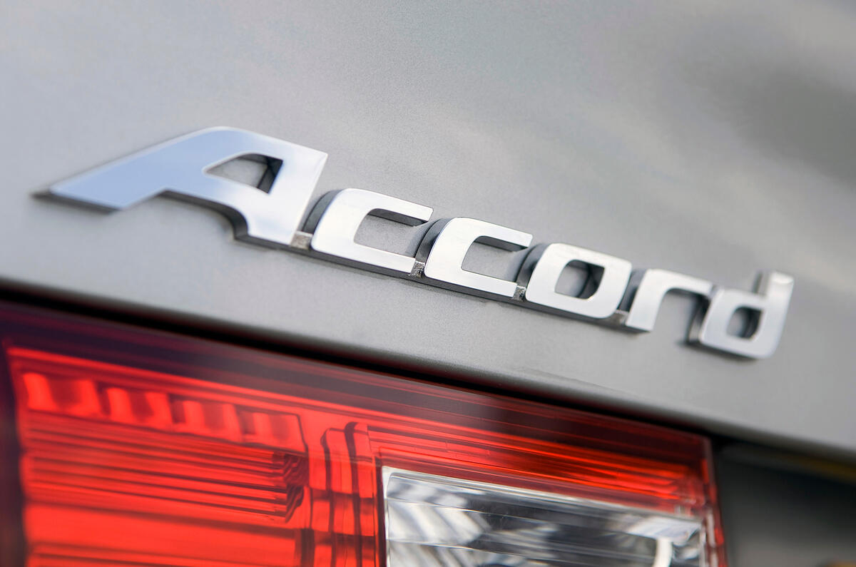 Compared with the otherwise cleanly designed Accord, the rear three-quarter is a bit of a mess Honda Accord badging