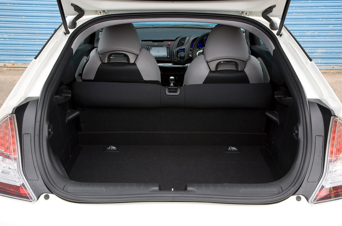 Boot space is 225 litres with the rear seats up; tyre toolkit sits under the floor Honda CR-Z boot space