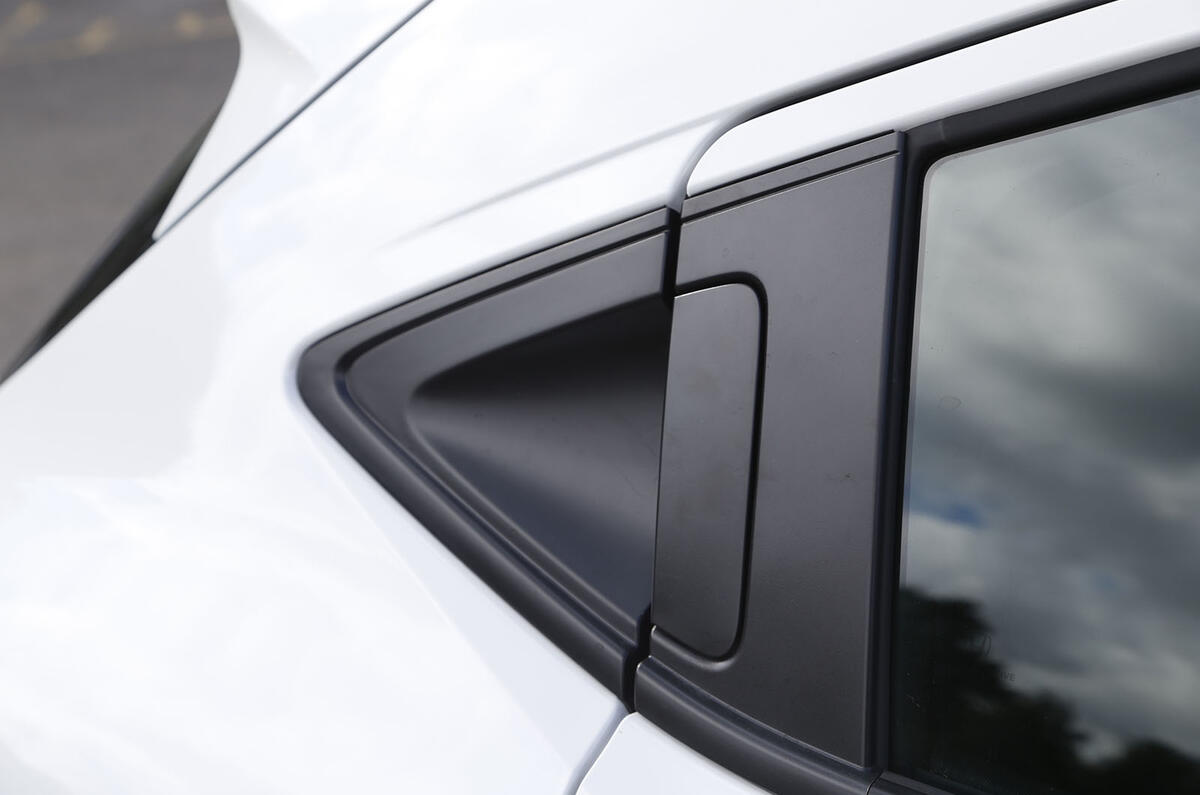 Door handles are concealed in the C-pillars on the Honda CR-V just like the Civic