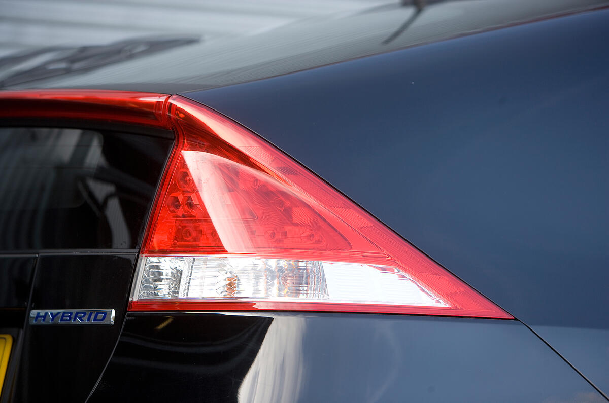 The top half of the body tapers in towards the rear of the car, which helps the air pass more smoothly over the top Honda Insight rear light