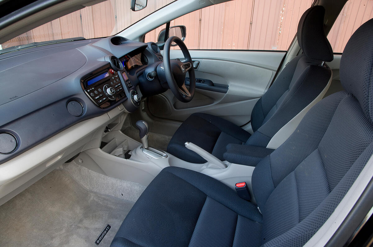 Low-slung seats make the Insight feel more like a conventional car than the Prius Honda Insight interior