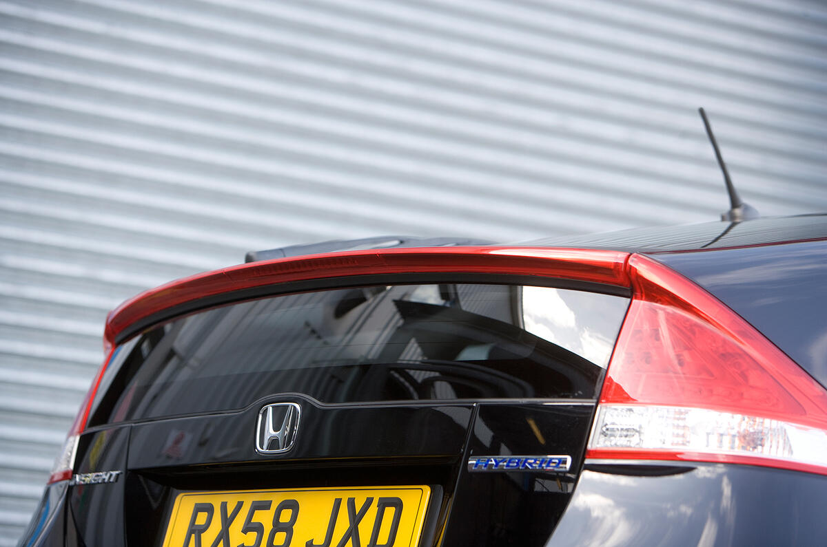 Like the Prius, the Insight’s slippery shape demands a high-reaching and near-vertical tail Honda Insight Prius-styled tail