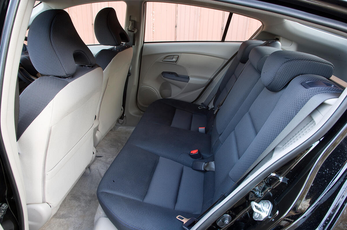 Headroom suffers slightly in the rear, but the seats are spacious for two adults Honda Insight rear seats