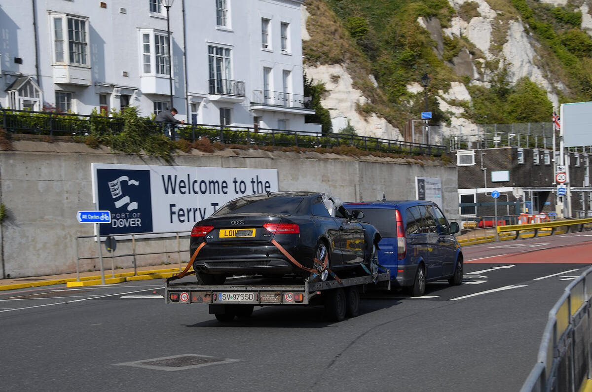 Dark van towing black car Dark van towing black car