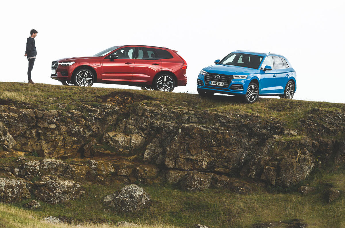 Audi and Volvo on ledge Audi and Volvo on ledge