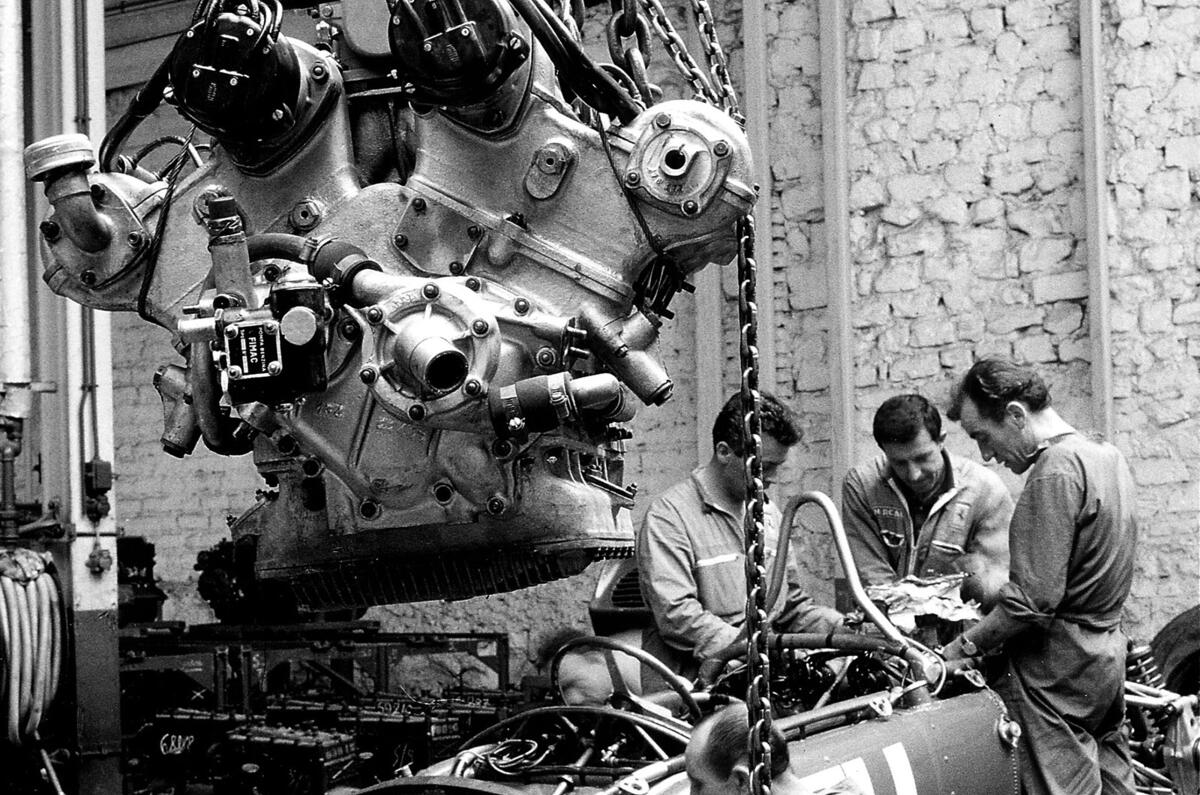 18 The car is the 156 F1  no. 50  The engine hanging  in the foreground  is 6 cylinder V of 65