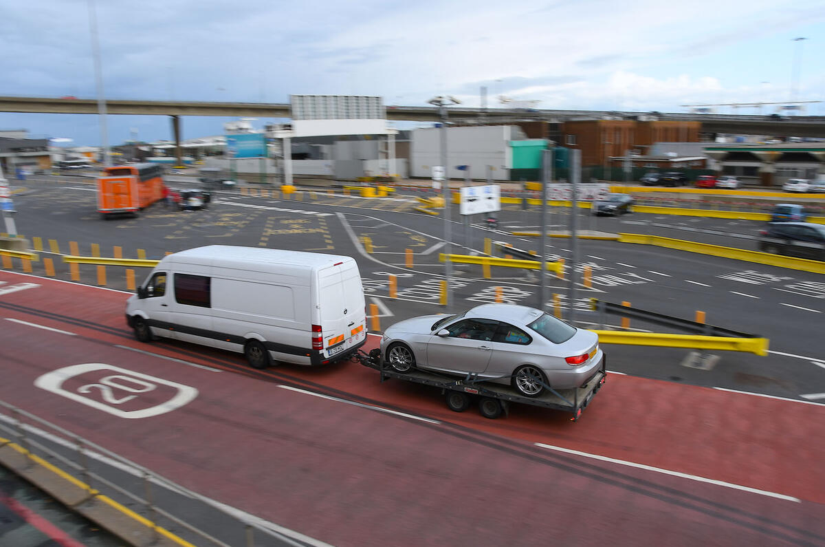 White van towing Mercedes
